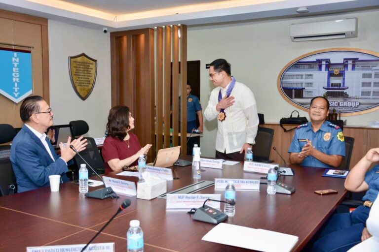 Participants seated around the conference table during the meeting