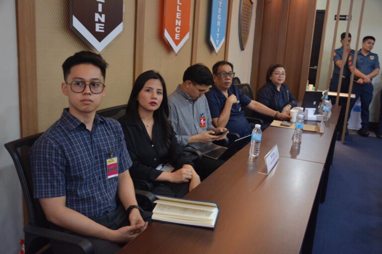 Attendees seated at the conference table