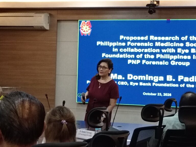 Dra. Dominga B. Padilla speaking before the research presentation screen
