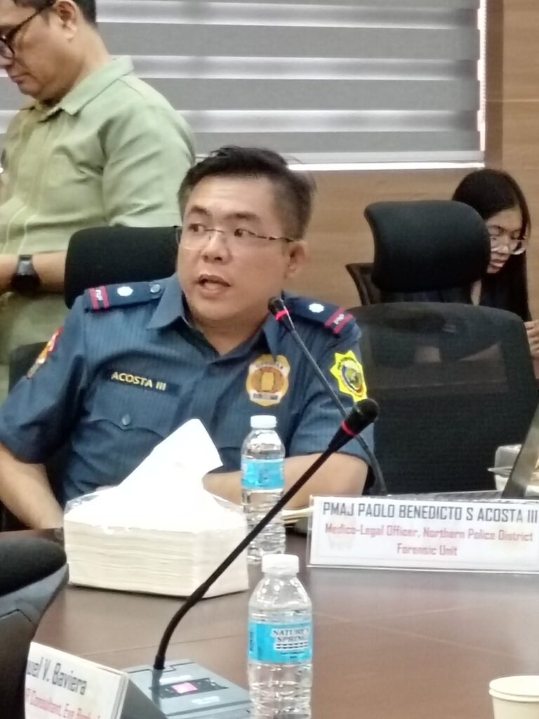 PNP officer seated at the conference table during the meeting